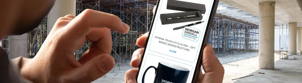 Modern corporate workspace with subtle construction elements welcoming users to the Morgan Sindall merchandise portal.